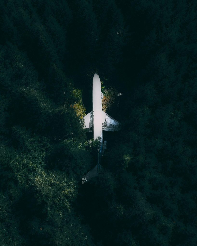 A commercial plane crashed in the jungle viewed from overhead