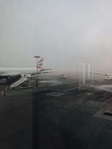 Airplane runway covered in fog